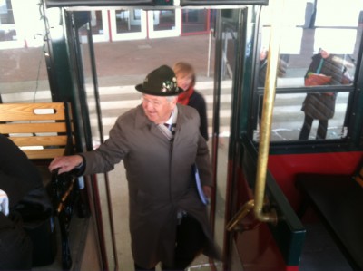 Rochester Mayor Ardell Brede boards one of two trolleys for a tour of the DMC District with fellow DMCC Board members.