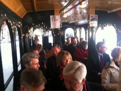 A trolley full of DMCC Board members, city and county officials, and other guests prepares to depart from the Mayo Civic Center.